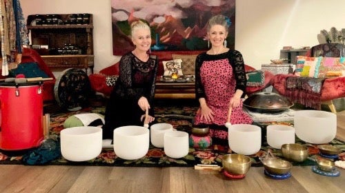 Sound bath instructors performing together
