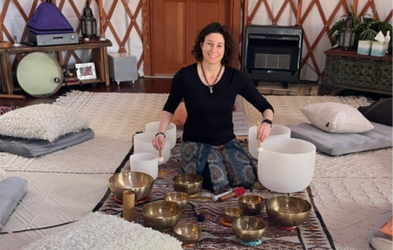 Woman playing singing bowls